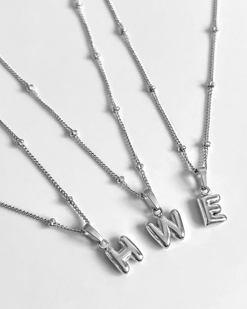 Tiny bubble initial necklace in silver